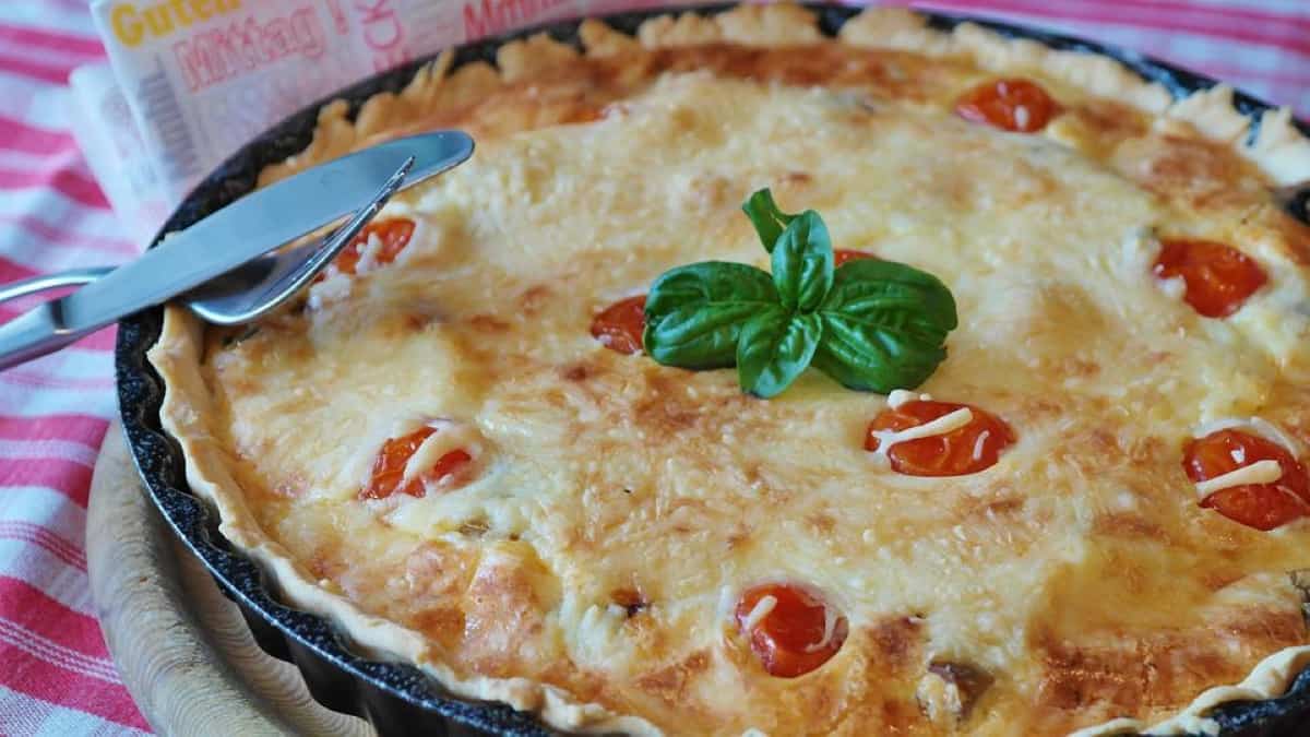 Quiche with tomatoes on top.