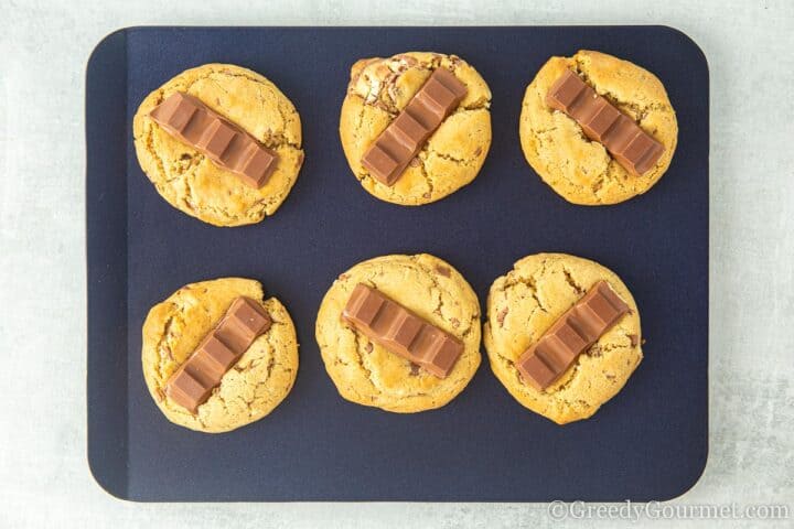 Cooked kinder cookies with kinder chocolate on top.