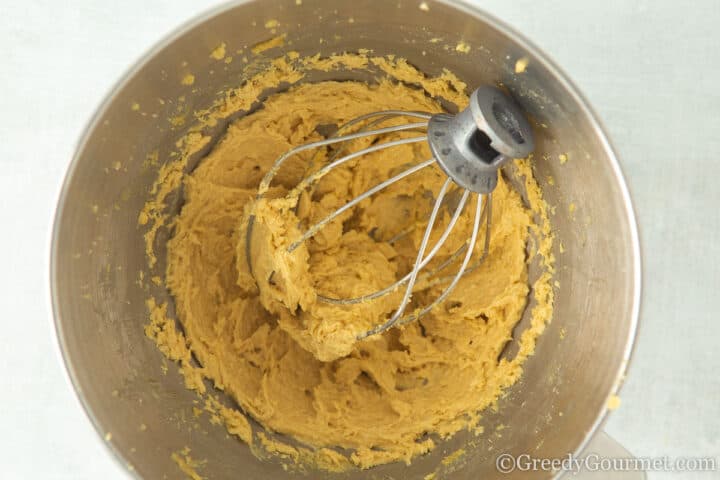 mixing cookie dough with a metal whisk.