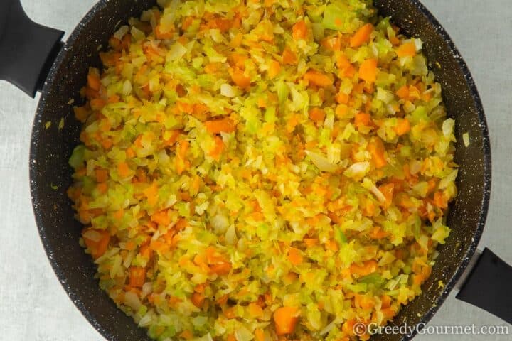 cooking mirepoix in a pot.