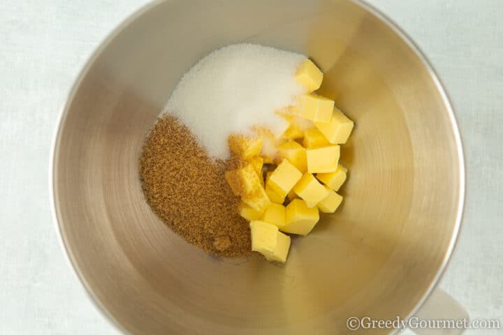 brown sugar, white sugar and butter in a mixing bowl.