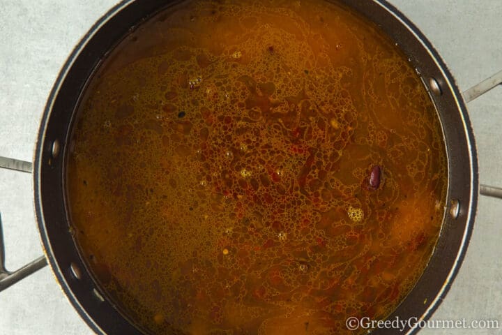 add stock and spices to the pot.