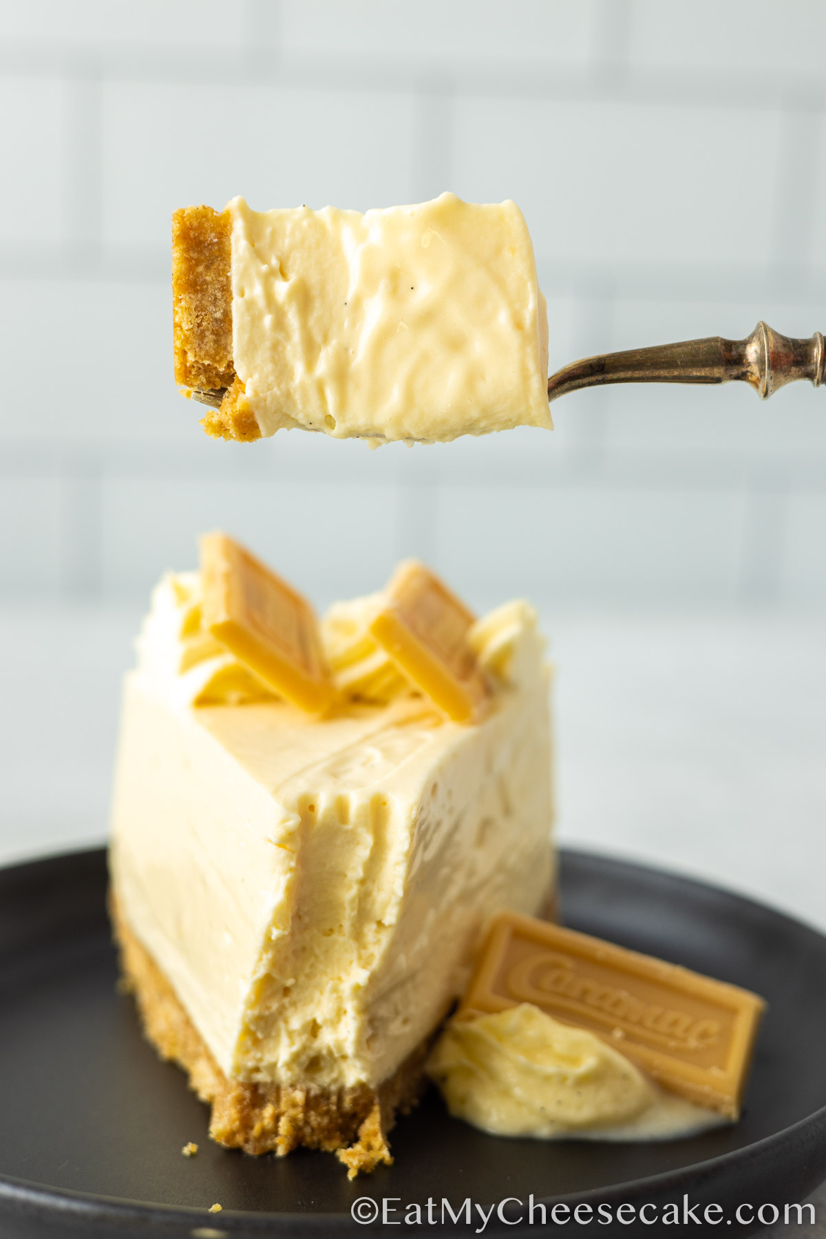 slice of caramac cheesecake with a fork.
