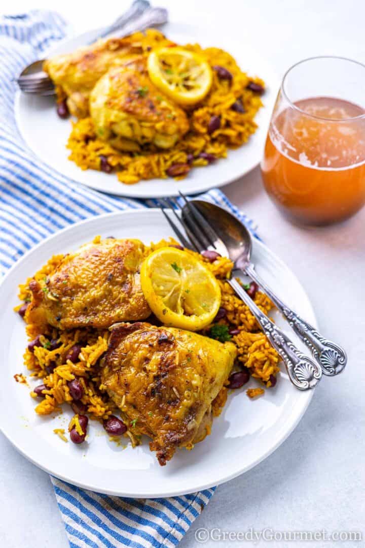 serving of chicken and rice on a plate. 