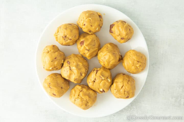 Kinder dough cookie balls on a plate.