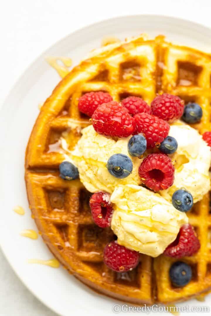 Mochi waffle served with ice cream and fresh berries.