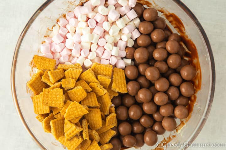 add biscuits marshmallows maltesers to bowl.