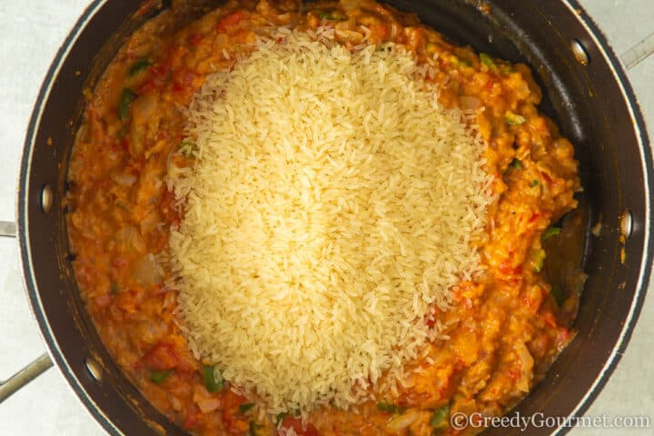 add rice to peanut butter, onion and tomato.