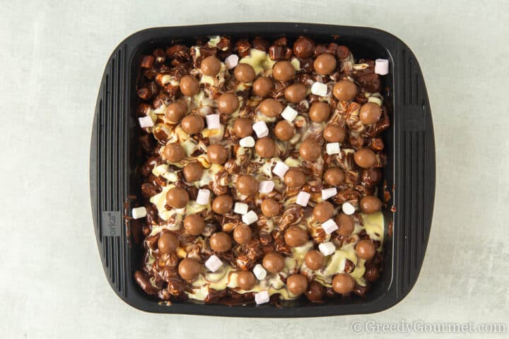 decorated rocky road with marshmallows andmaltesers.