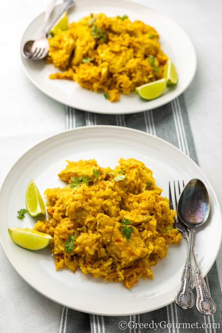 serving of Caribbean peanut chicken with a wedge of lime.