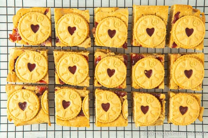 jammie dodger blondies on cooling rack.