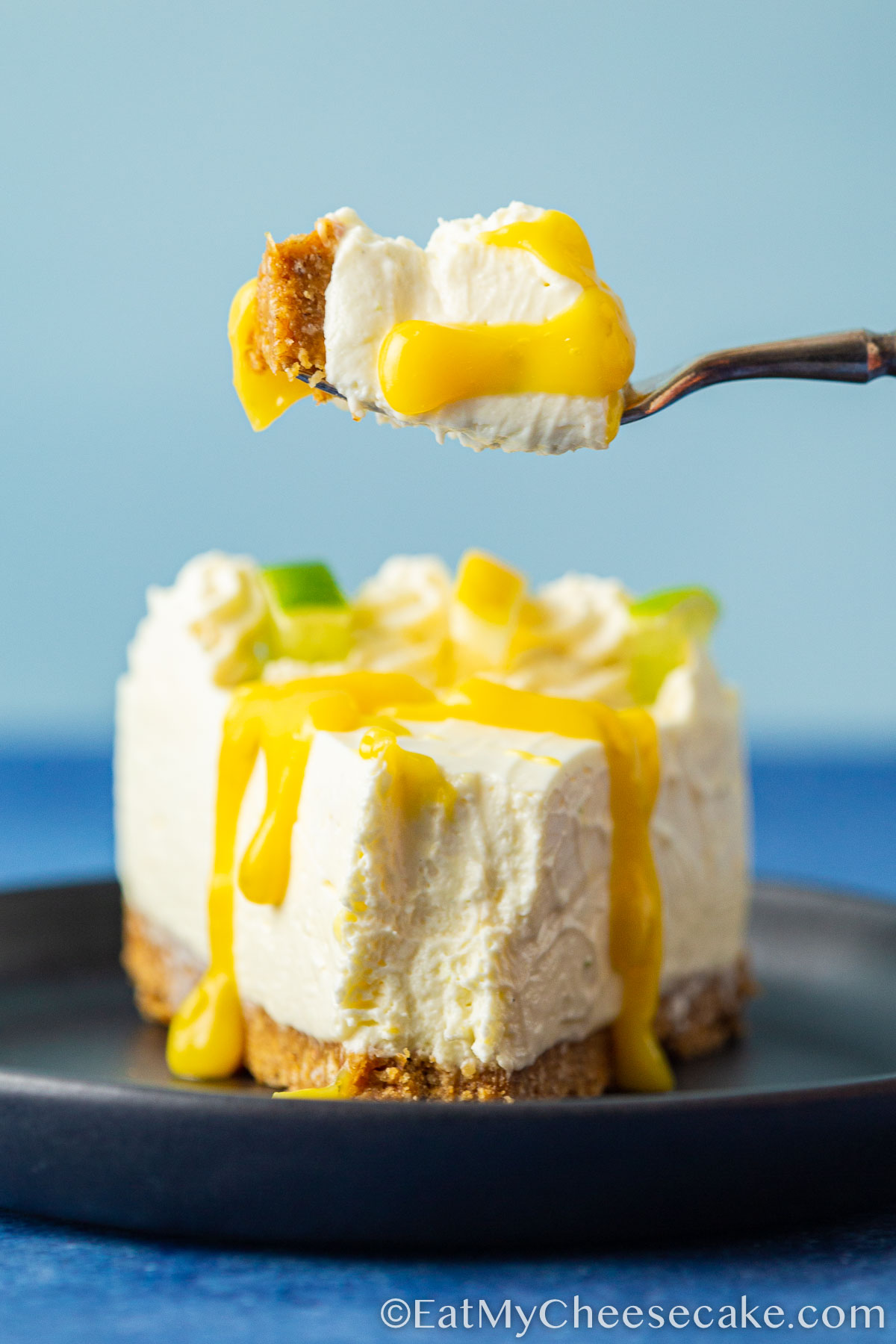 bite of cheesecake drizzled in lemon and lime curd.