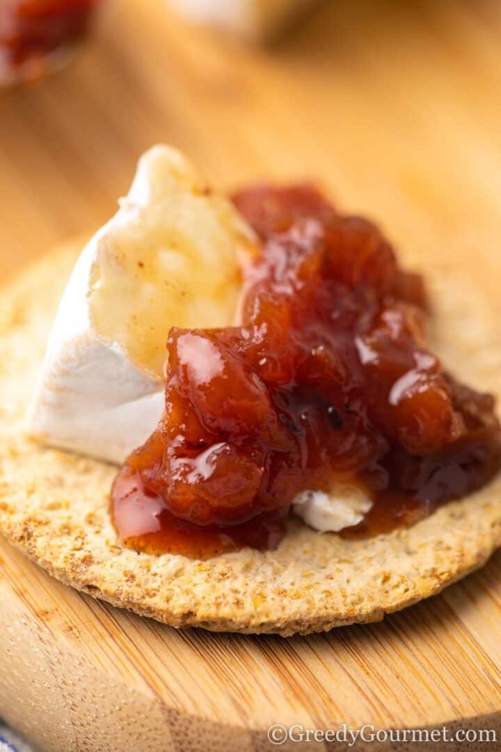 nectarine chutney and cheese on a cracker.