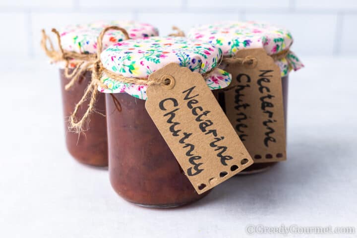 nectarine chutney in glass jars.