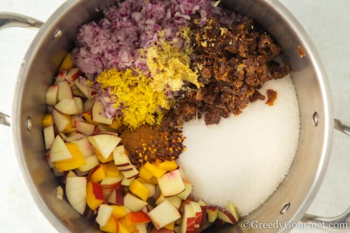 nectarine chutney ingredients in a pot.