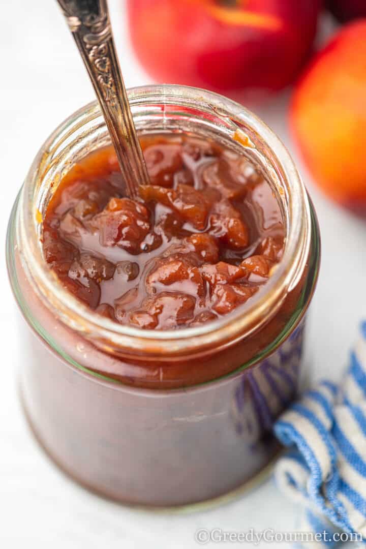 nectarine chutney in a glass jar.