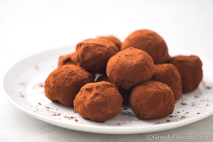 Chocolate Mochi stacked on a plate.