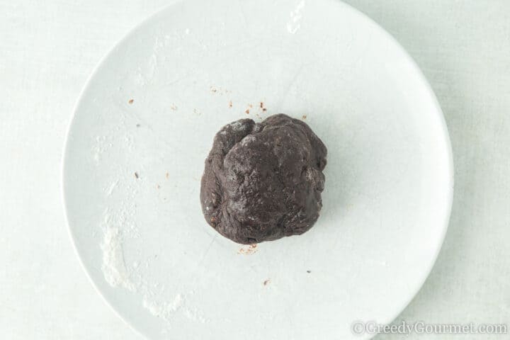 Dark brown coloured mochi dough.