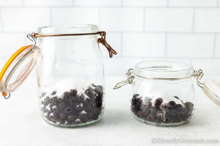 add sugar to berries in the jar.
