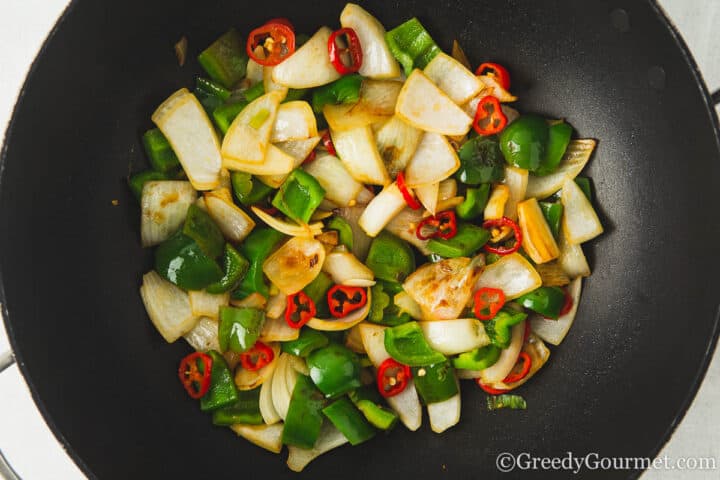 frying onion, pepper and chillies.
