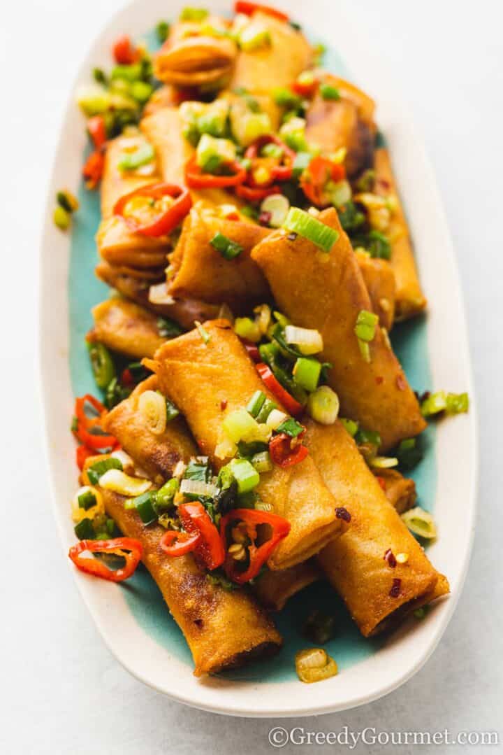 salt and pepper spring rolls on a serving dish.
