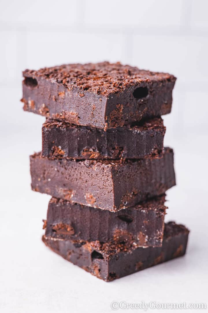 mochi brownie pieces stacked in a tower.