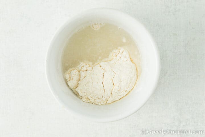 flour and water in a bowl.