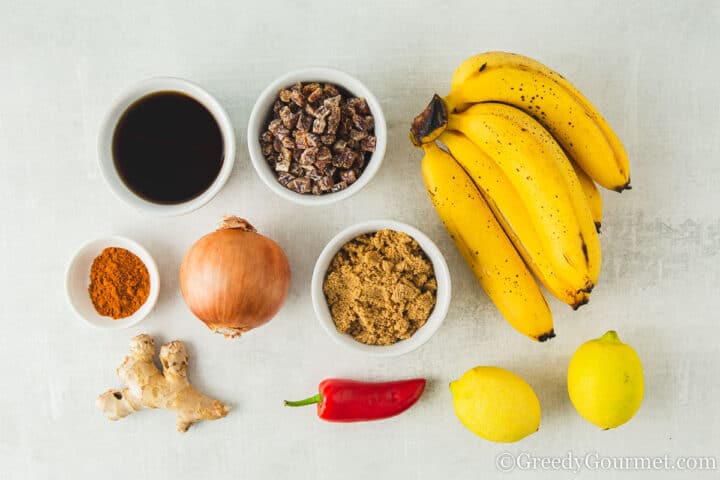 ingredients for banana chutney laid out on a table.