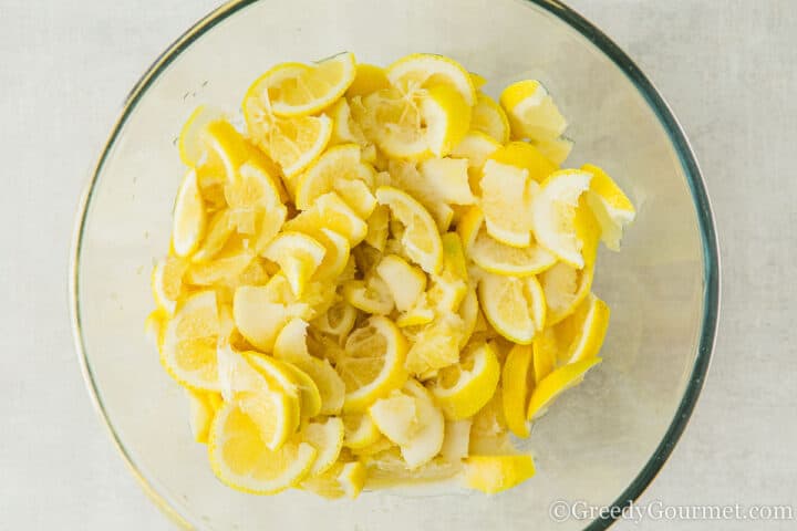 chopped lemons and salt in a bowl.