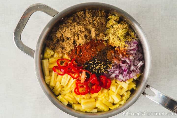 chopped raw ingredients in a large pot.