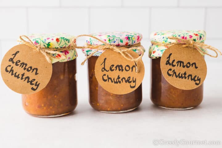 3 jars of lemon chutney side by side.