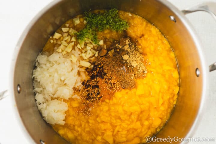 mango chutney ingredients in a cooking pot.