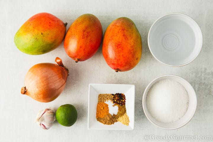 ingredients for mango chutney on a table.
