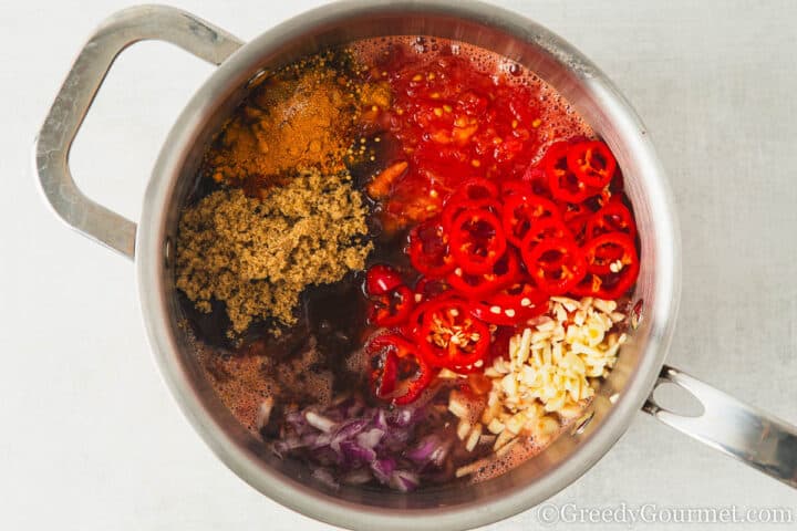 tomato chutney ingredients in a large pot.