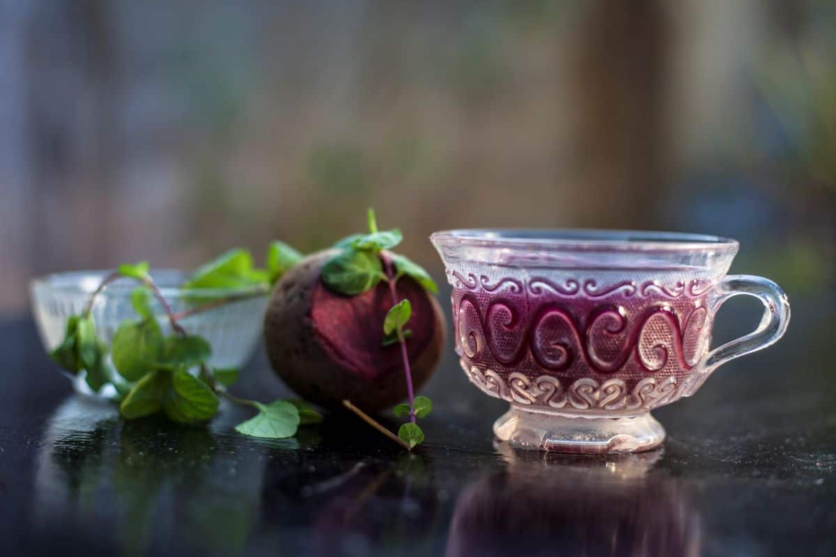 beet syrup in a small cup.