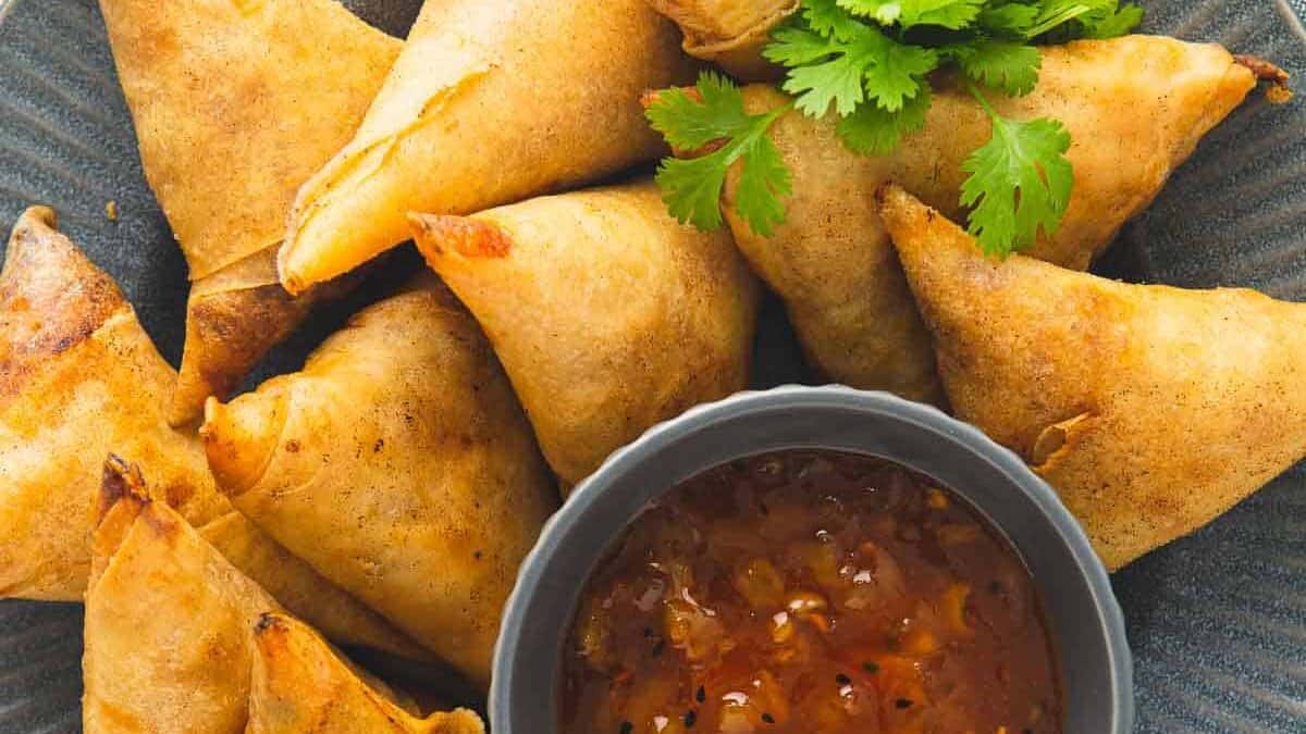 serving samosas with chutney.