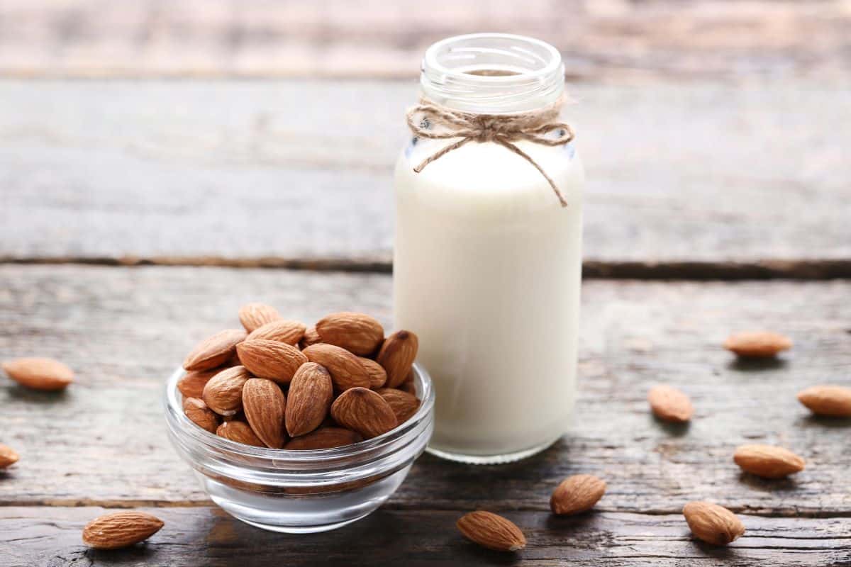 almond milk with a bowl of almonds.