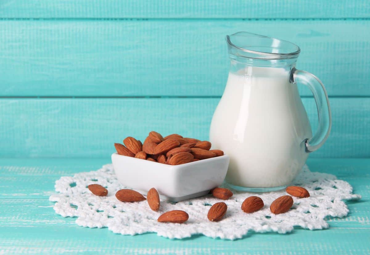 almond milk with a bowl of almonds.