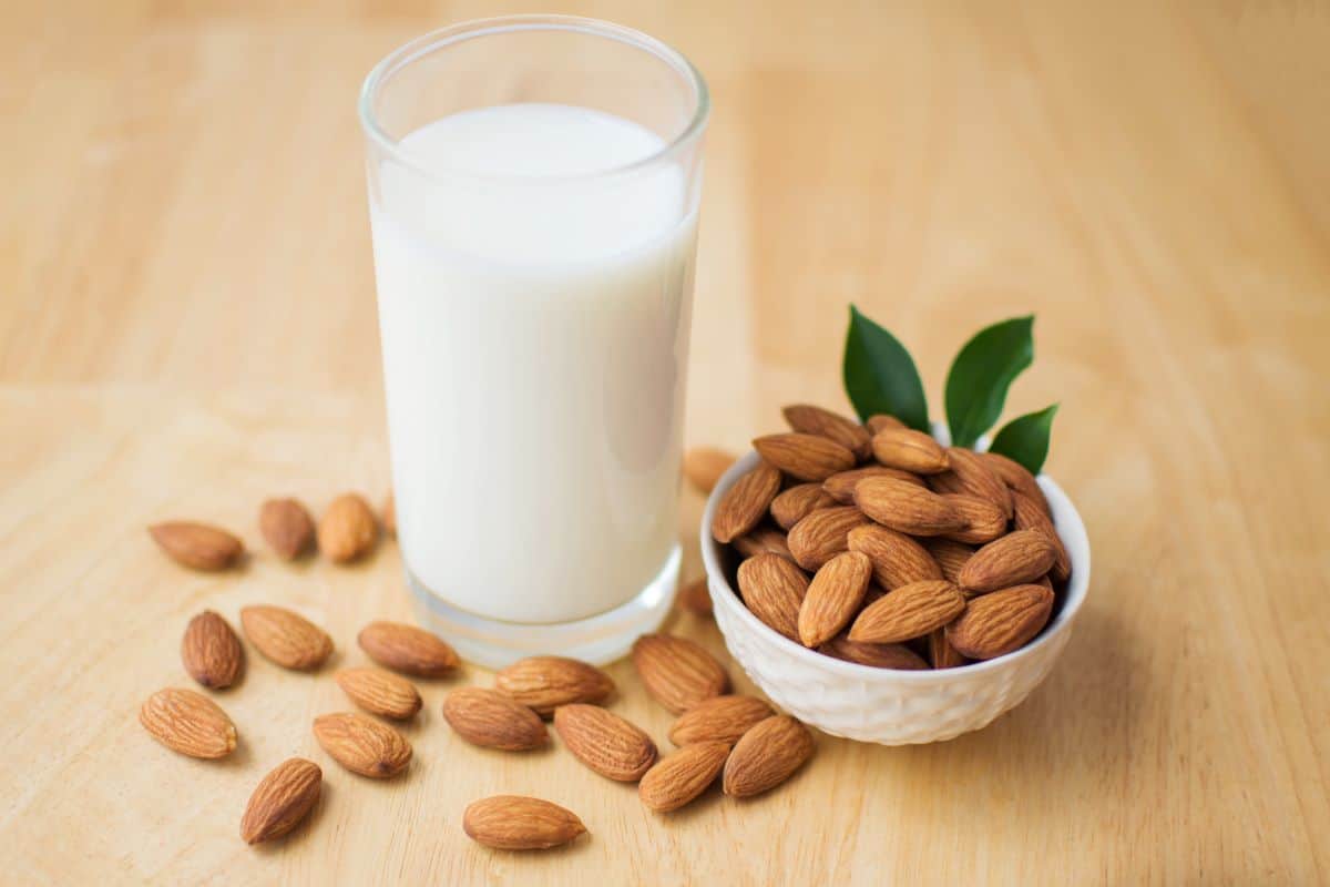 almond milk with a bowl of almonds.