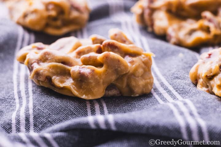 Pecan pralines on a cloth.