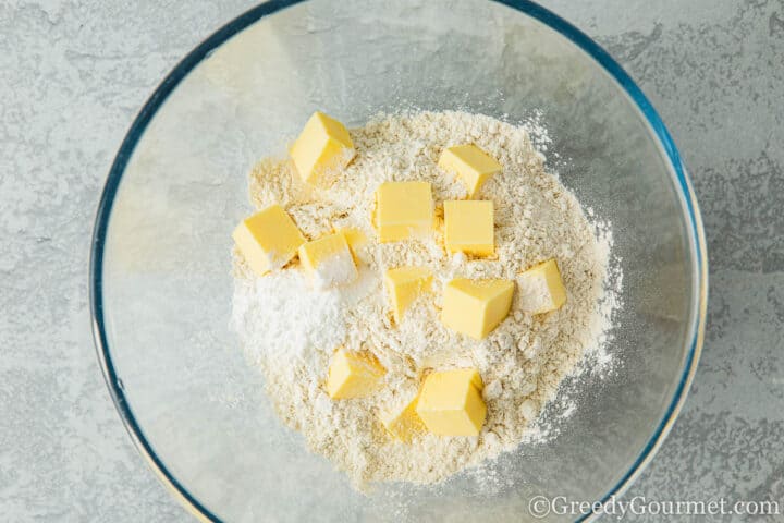 Cold butter and flour in a bowl.