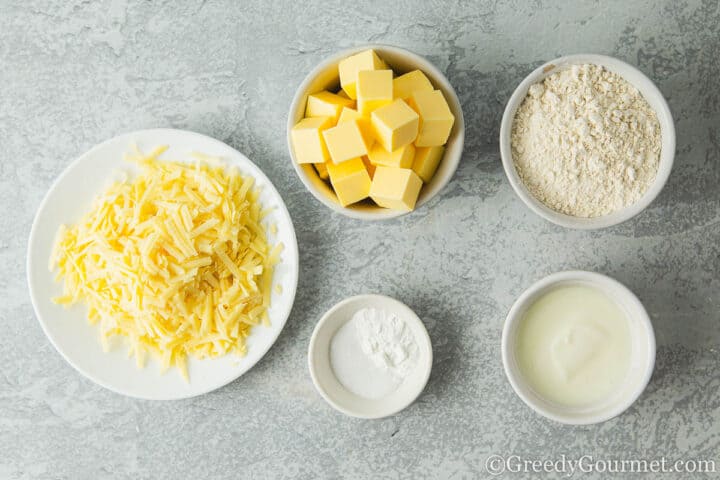 Flour, butter and buttermilk in bowls.