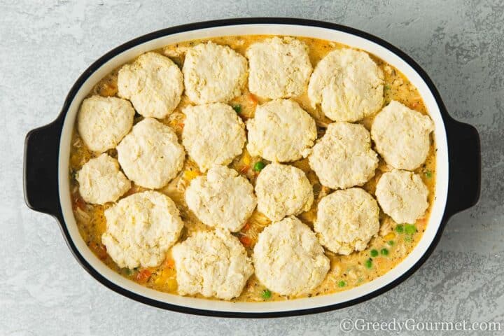 Raw dough balls on cobbler dish.