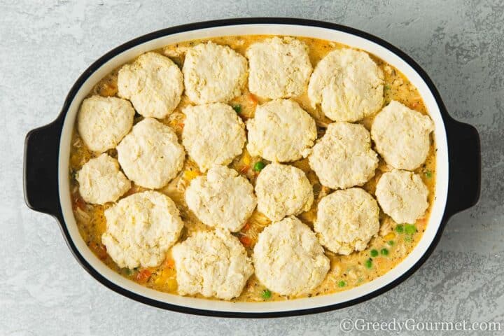 Raw dough balls on cobbler dish.