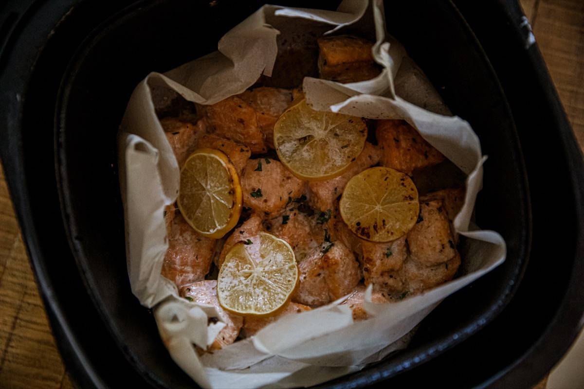 Air fryer salmon bites in the air fryer.