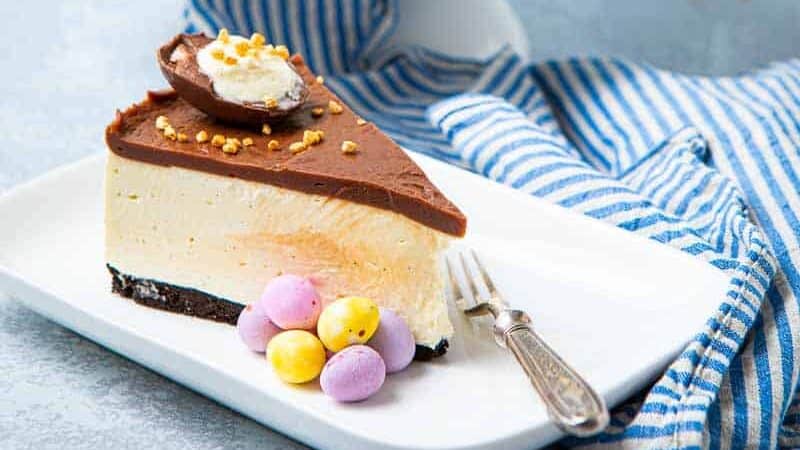 Whole cheesecake with a slice removed
