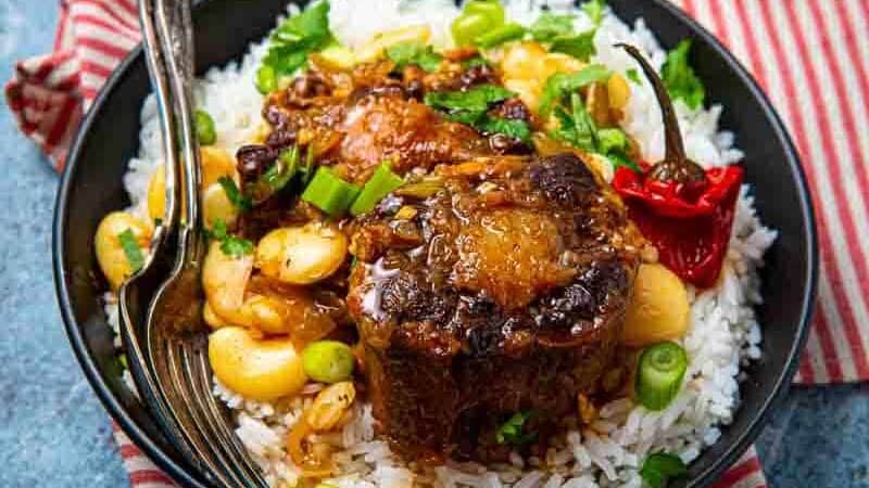 Full Carribean meal, oxtail over rice