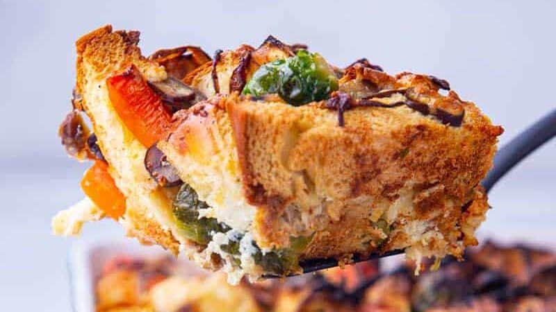 Colorful slice of savory bread pudding