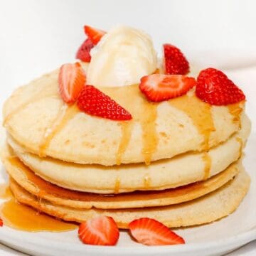 Air fryer pancakes with strawberries and ice cream.