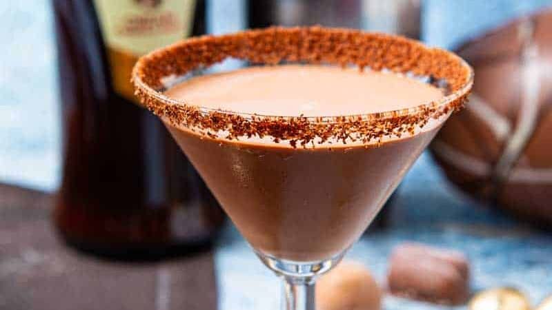 Martini glass rimmed with chocolate sugar and liquid amarula inside